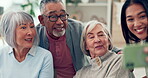 Friends, senior people and happy selfie with a caregiver in a nursing home. Elderly women and a man smile together for social media, profile picture or memory with a young person in retirement