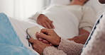 Holding hands, bible and elderly women in hospital for prayer, hope or support, empathy and comfort. Senior friends, book of religion and patient with cancer, sick or medical disease on bed in clinic