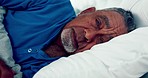 Depressed, thinking and old man in bed, sad and alone with retirement, grief and feeling lonely. Retired, senior male person or pensioner with loss, bedroom or home with mental health or depression  