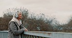 Bridge, senior woman and headphones with music and thinking outdoor with view. Elderly female person, web radio and mockup space feeling relax in retirement with audio and freedom on calm holiday