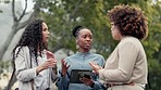 Tablet, meeting and business women in park for discussion, planning and networking. Corporate, teamwork and female workers outdoors talking for review, project and online proposal on digital tech