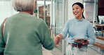 Happy woman, physiotherapist and handshake in elderly care for schedule appointment or meeting at clinic. Female person or medical healthcare professional shaking hands with senior patient in checkup