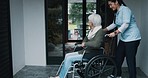 Senior woman, wheelchair and nurse help with service and caregiver outside retirement home. Discussion, smile and person with a disability together with happy conversation and nursing professional