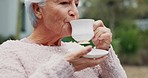 Drinking, retirement and senior woman with tea in garden for calm, peace and relaxing in morning. Nursing home, happy and carer giving beverage to elderly woman for happiness, wellness and support