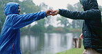 Couple, dancing and happy date in outdoor park, nature or camping in the forest for vacation, trip or fun adventure together. Men, dance and celebration of love, relationship and quality time