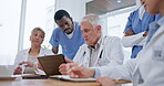 People, doctor and meeting on tablet in team discussion for healthcare strategy or planning at the office. Group of medical professionals in teamwork for surgery, research or collaboration at clinic