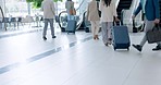 Airport, travel and the back of business people on an escalator for international transport with luggage. Corporate, world and professional employees in a terminal, leaving for a trip or journey