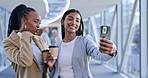 Selfie, coffee and business women in office while on lunch break talking, bonding and laughing. Happy, cheers and professional female colleagues or friends taking picture with cappuccino in workplace