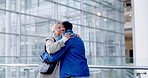 Business, welcome and a man hugging a woman in the office, greeting a colleague with a friendly smile. Collaboration, meeting a senior female mentor embracing a professional employee in the workplace