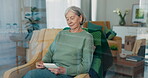 Senior woman, photograph and thinking of memory on a home sofa for nostalgia, history and to remember. An elderly female person with pictures of old album, nostalgia and photography in retirement