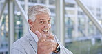 Finger gun, man and happy portrait of senior businessman walking in office with a smile from success or support. Ceo, shooting and funny manager with employee or hand sign and gesture at work