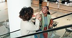 Business women, talking and high five on escalator for startup pitch success, achievement or partnership travel deal. Smile, laughing or African people on moving stairs in airport lobby for team trip