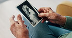 Photograph, hands and memory of a person on a home sofa for nostalgia, history and to remember. Senior adult with pictures and thinking of old album, nostalgia and wedding photography in retirement