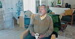 Thinking, calm and elderly man on a chair in the living room of his retirement home.Dreaming, relax and peaceful senior male person with an idea, vision or brainstorming in the lounge of his house.