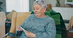 Memory, photograph and senior woman on a home sofa for nostalgia, history and to remember. An elderly female person with pictures while thinking of old album, nostalgia and photography in retirement