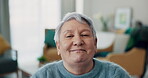 Smile, face and a senior woman in a home to relax in retirement in the living room. Happy, calm and a closeup portrait of an elderly person in a lounge of a house with confidence, pride and mature