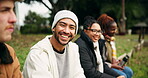 Face, smile and a happy man camping with his friends in the forest or woods for travel, freedom and adventure. Portrait, nature and diversity with a group of people in the wilderness together