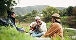 Music, guitar and friends camping in nature with laughing, freedom and happy celebration at lake. Forest, outdoor adventure and singing, men and women on river grass on summer weekend camp together.