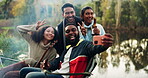 Selfie, bonfire and friends with beer for camping or a celebration and to update social media of a vacation together. Internet, travel and group of people happy for a online picture in the woods