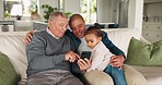 Grandpa, father and girl with a cellphone, home and social media with connection, internet search and streaming cartoon with app. Old man, male parent and kid on a couch, smartphone and quality time