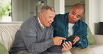 Phone, couch and senior father with man search social media, web and website in a home together in a living room. Discussion, conversation and elderly person talking with son on internet in a lounge