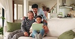 Happy, talking grandparents and child with a tablet for games, a cartoon or movie in a home lounge. Smile, family and a senior man, woman and child with technology and headphones for education