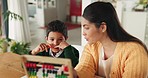 Homework, math and mother with abacus for child for learning, studying and counting at table. Education, teaching and happy mom with son in home for development, growth and knowledge for lesson