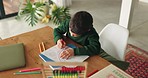 Creative, boy and home with kindergarten education, learning and color for development. Book, school homework and young child with student growth and drawing in a house with paper and illustration