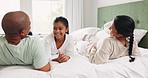 Happy man, woman and child on bed, talking and quality time together, interracial family relax in home. Discussion, bonding and girl in bedroom with mother, father and smile in morning conversation.