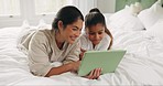 Family, bed and tablet in a home with digital education and game with website streaming. House, bedroom and mother with young girl relax together with learning and child smile on a app with tech