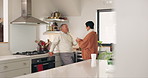 Old couple in kitchen, talking and bonding with coffee, relax with morning routine and communication with trust. Commitment, marriage and life partner, man and woman at home, tea and chat with love