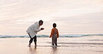 Beach, love and grandmother playing with child in the water at sea happy for holiday or outdoor vacation together. Adventure, travel and grandma bonding kid or boy for quality time by the ocean