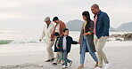 Family, walk on beach sand and holding hands, generations and travel with ocean, trust and bonding outdoor. Winter, nature and grandparents with parents and children, adventure and freedom on journey