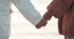 Couple, closeup of hand holding and beach, travel and commitment with love and date outdoor. People together in nature, holiday and adventure with support and trust, marriage and life partnership