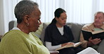 Elderly black woman, bible and group in home, worship and prayer together. Senior people, religion and study, spiritual praise and reading in knowledge, guide and community faith in retirement house