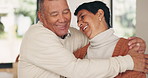 Phone, love and a senior couple hugging in their home together while enjoying retirement. Trust, care and romance with an elderly woman embracing his wife while browsing social media on a mobile