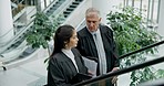 Conversation, talking and legal team in collaboration on a court case or criminal investigation. Discussion, escalator and professional female lawyer talking to her senior attorney judge mentor.