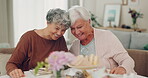 Happy, conversation and tea with senior friends in living room for support, relax and wellness. Smile, retirement and social with old women talking in nursing home for bonding, care and chat together