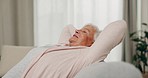 Smile, relax and senior woman stretching on sofa in home living room for peace. Happy, calm and elderly person with relief, freedom and no stress, breathing and comfort on couch in lounge in house.