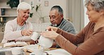 Senior, book and friends with tea at a table for reading, retirement meeting and hobby together. Talking, happy and an elderly man with women, coffee and food with a discussion about a story