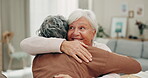 Happiness, face and senior friends hug in friendship reunion, bonding and enjoy retirement time together in home living room. Love, support or happy people embrace, care and smile from elderly women 