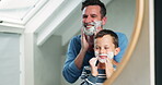 Child, father and shaving cream on face in bathroom, mirror or learning about beauty, care and grooming in family home. Dad, teaching boy and skincare routine or shave with hair removal product