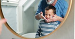 Dad, boy and shaving cream on face in bathroom, mirror or learning about beauty, care and grooming in family home. Teaching, skincare and shave routine with foam, product or care with cosmetics