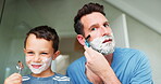 Face, shaving and a father teaching his son about grooming or hygiene in the bathroom of their home together. Family, children and skincare with a boy learning how to shave with his single parent