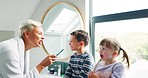 Mom, children and bathroom with teaching, brushing teeth and check for mouth, gums and hygiene in home. Mother, young kids and learning with toothbrush, health and cleaning in morning at family house