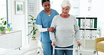 Old woman with disability, nurse and patient with physical therapy, healthcare and elderly care at clinic. Female people, physio and health, wellness with rehabilitation and caregiver in consultation