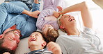 Parents, children and playing on bed in top view with bonding, comic laugh and funny game in family home. Mother, dad and young kids with quality time, tickling and happy together in bedroom at house