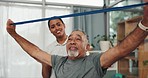 Old man, doctor and physical therapy, resistance band and muscle with strength training and health. Female physiotherapist, male patient and rehabilitation, chiropractic and strong with elderly care