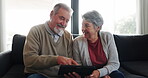 Senior couple, tablet and streaming a movie on couch, sofa or watching a tv show or series on internet in living room and home. Happy, elderly man and woman together to watch a video on mobile app