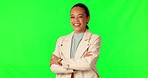 Crossed arms, green screen and face of happy woman in studio with confidence and positive mindset. Happiness, smile and portrait of young professional female person isolated by chroma key background.